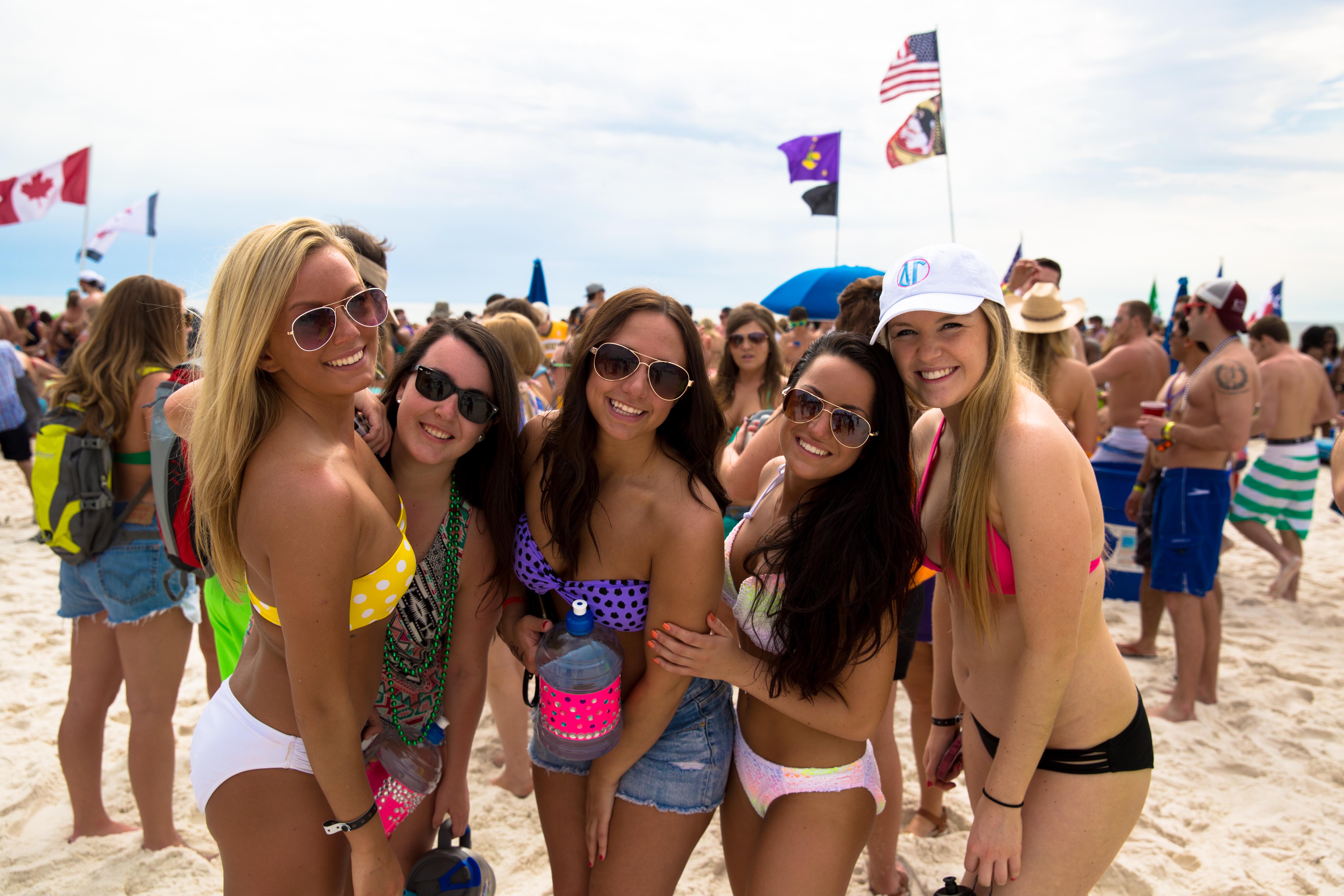 group of girls in bikinis on the beach in Panama City Beach, Florida.