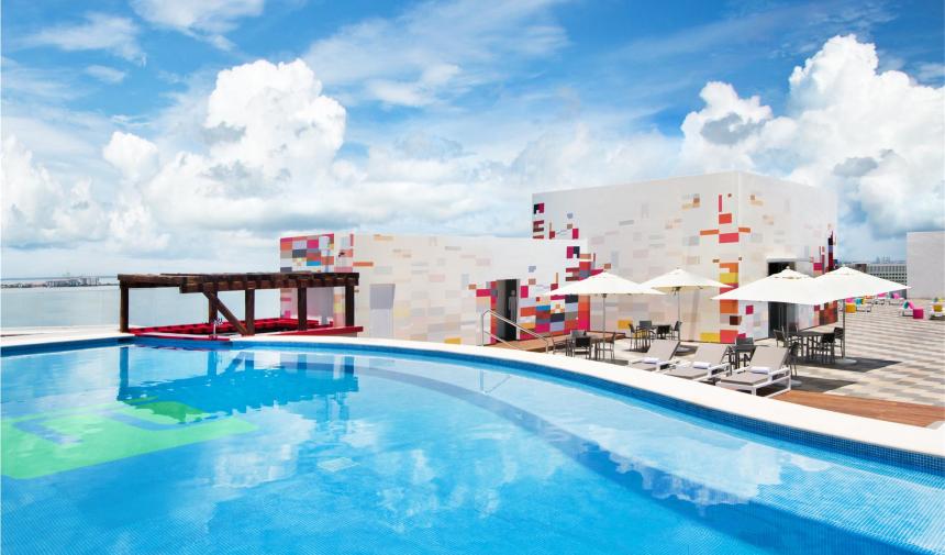 the pool area at the Aloft spring break hotel in cancun