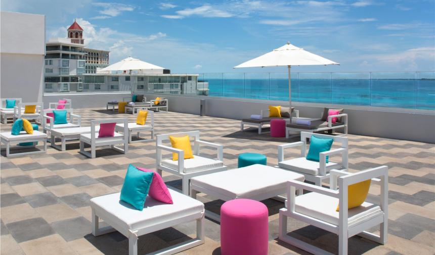 outdoor seating area at the Aloft spring break hotel in cancun