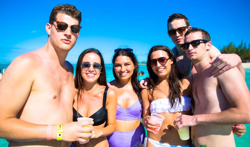 6 spring breakers on the beach in the Bahamas