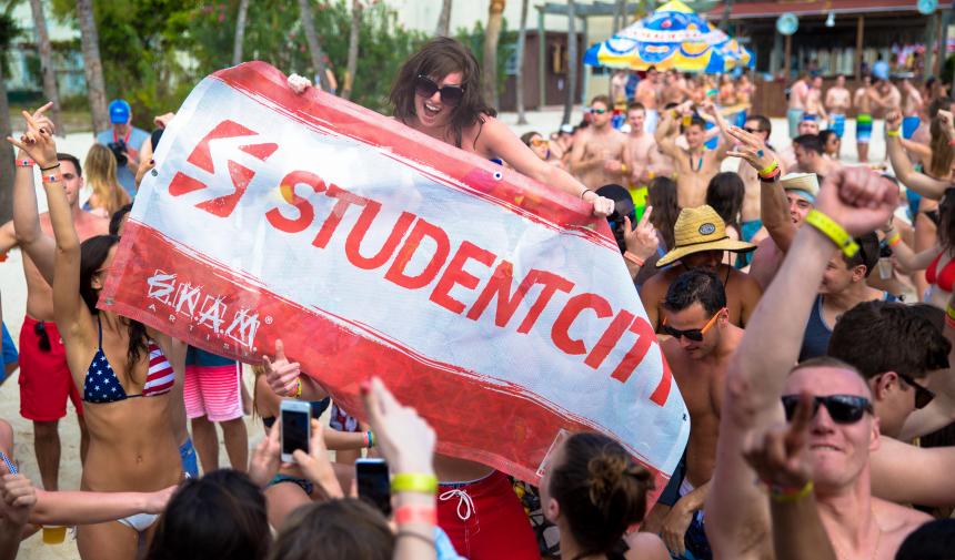 group holding up a StudentCity banner
