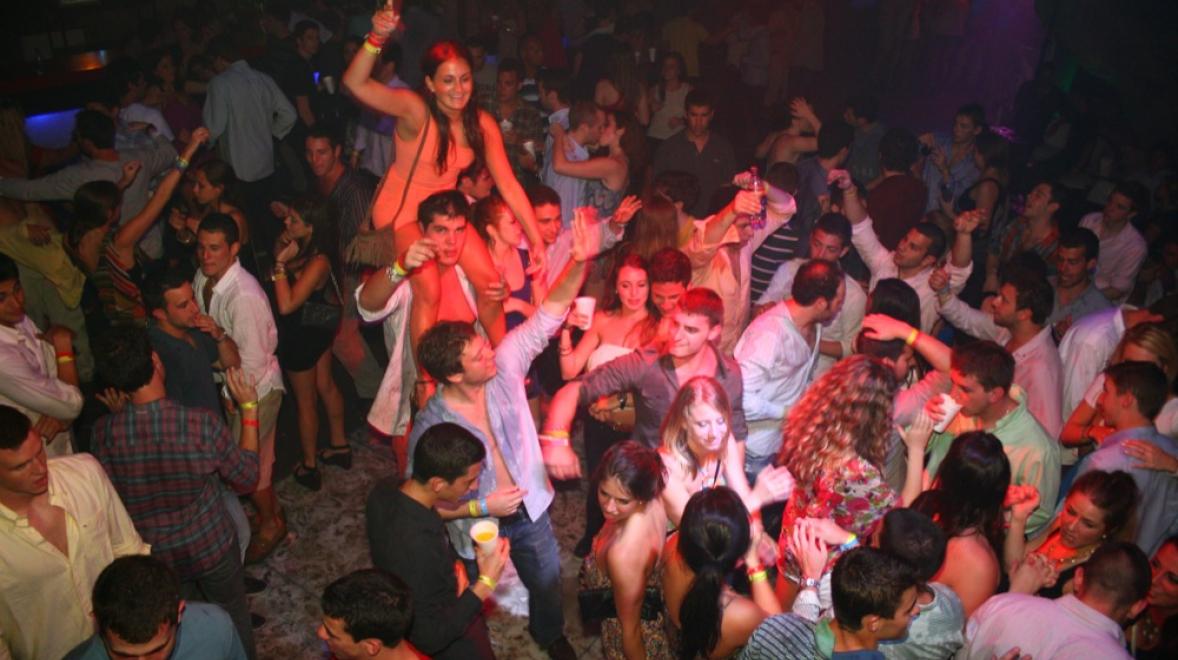 a group of people on spring break in Punta Cana partying in a club