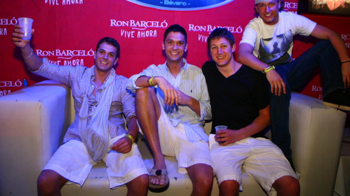 4 guys sitting on a couch inside of a Punta Cana club