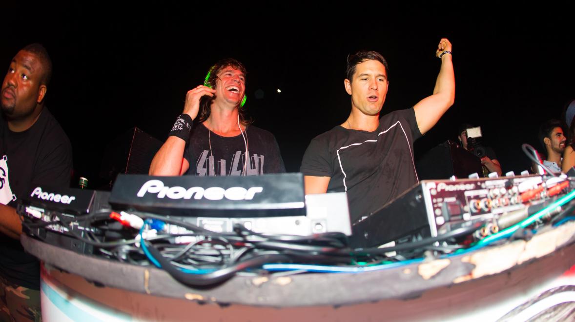 3 DJs  performing at the Inception Musical Festival in Cancun. One is laughing.